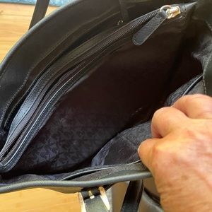 Black purse. Michael Kors. Used but still in great shape.